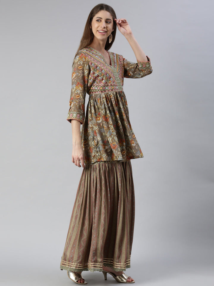 Neerus Green muslin embroidered kurta set with skirt and dupatta - back view