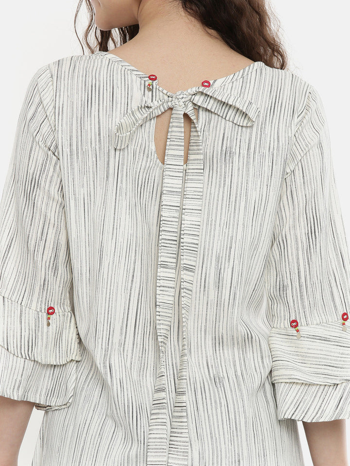 Neerus Beige cotton embroidered A-line kurta - back view