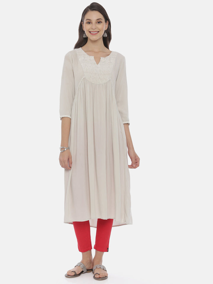 Neerus Beige rayon solid kurti - front view