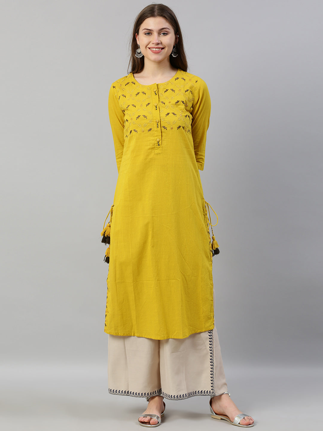 Neerus Yellow slub cotton embroidered straight kurta - front view