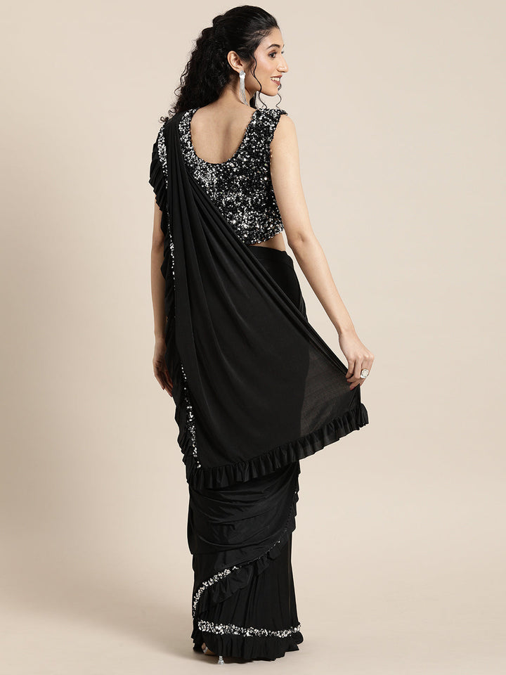 Neerus Black lycra draped saree - back view