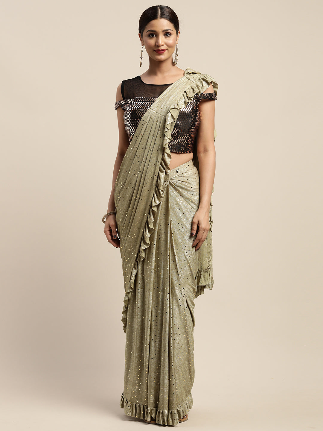 Neerus Green viscose rayon drape saree with stitched blouse - front view