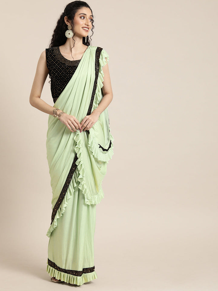 Neerus Green georgette solid saree with blouse - front view