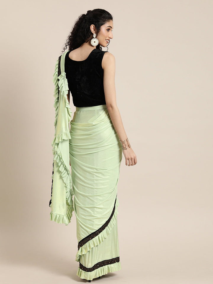 Neerus Green georgette solid saree with blouse - back view