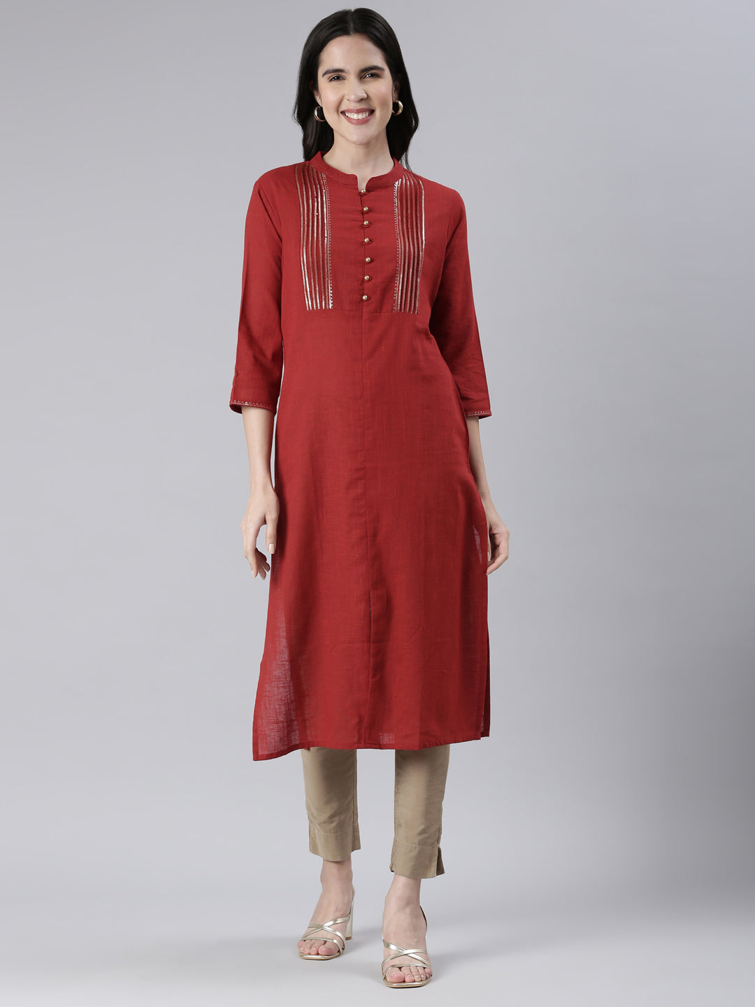 Neerus Maroon cotton solid straight kurta - front view