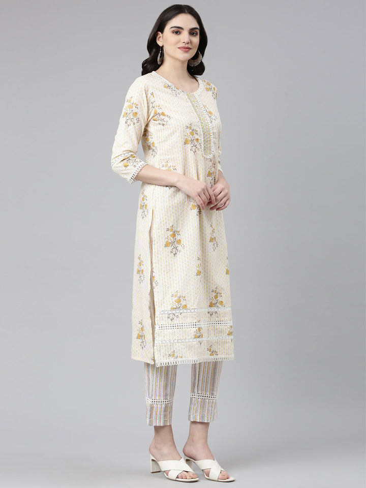 Neerus Yellow cotton printed kurta set with trouser and dupatta - back view