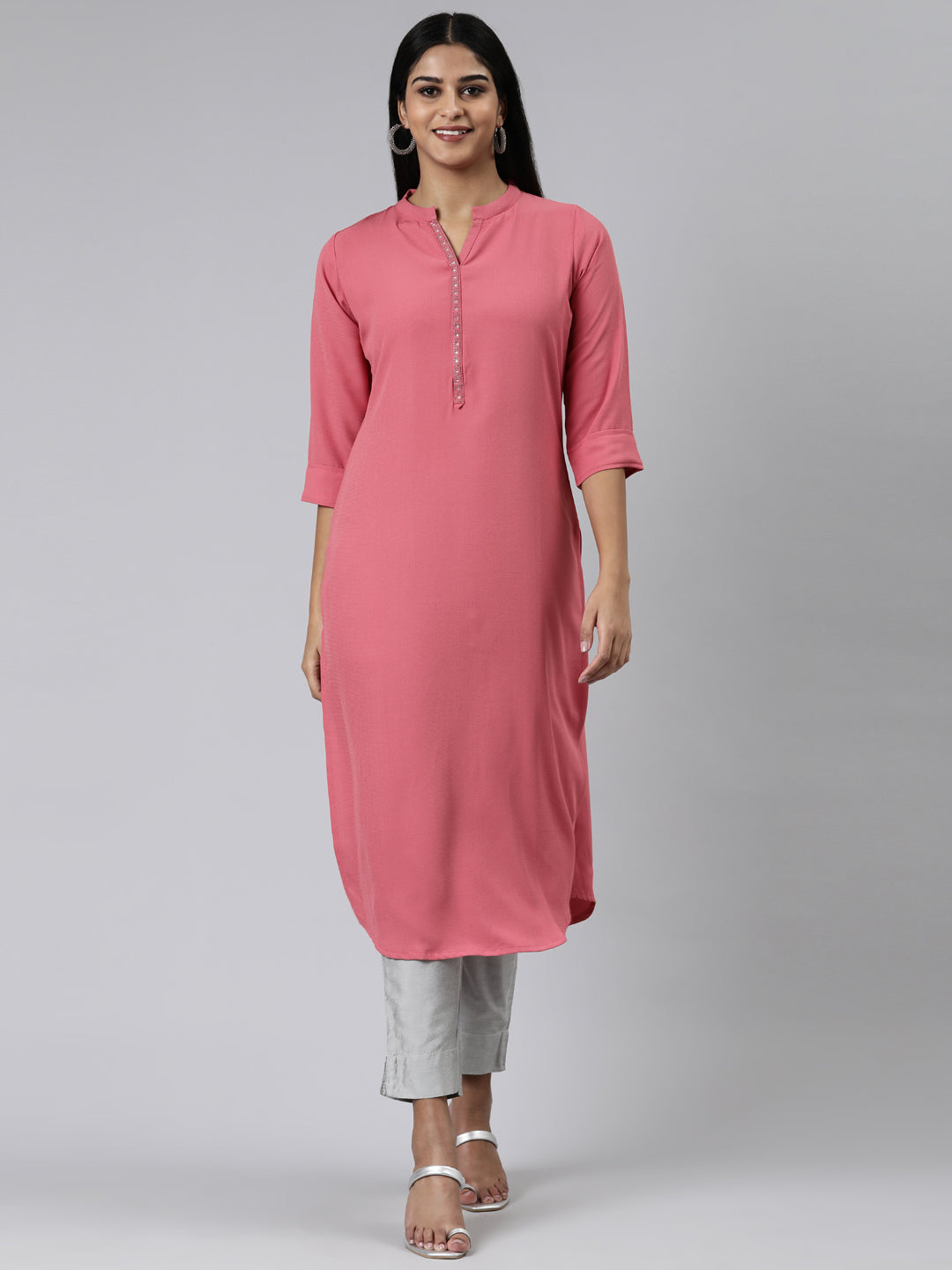 Neerus Pink viscose rayon solid straight kurti - front view