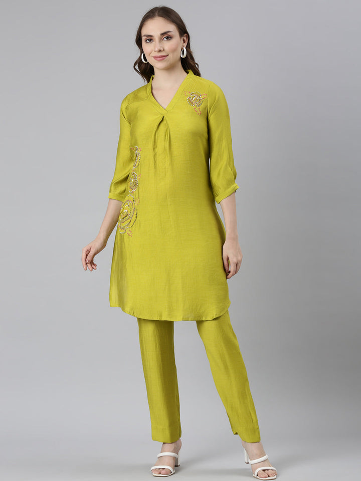 Neerus Green solid curved kurta set with trouser - front view