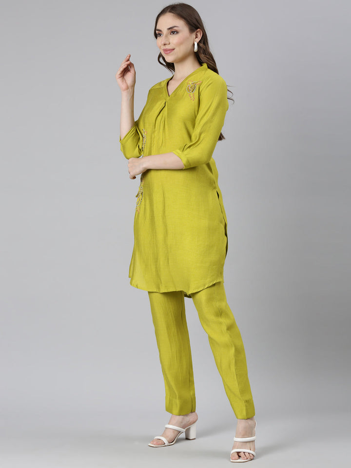 Neerus Green solid curved kurta set with trouser - back view