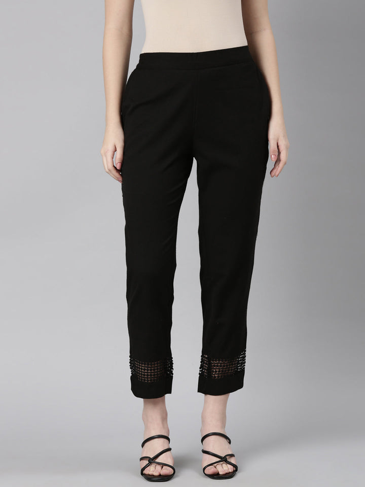 Neerus Black solid straight pant - front view