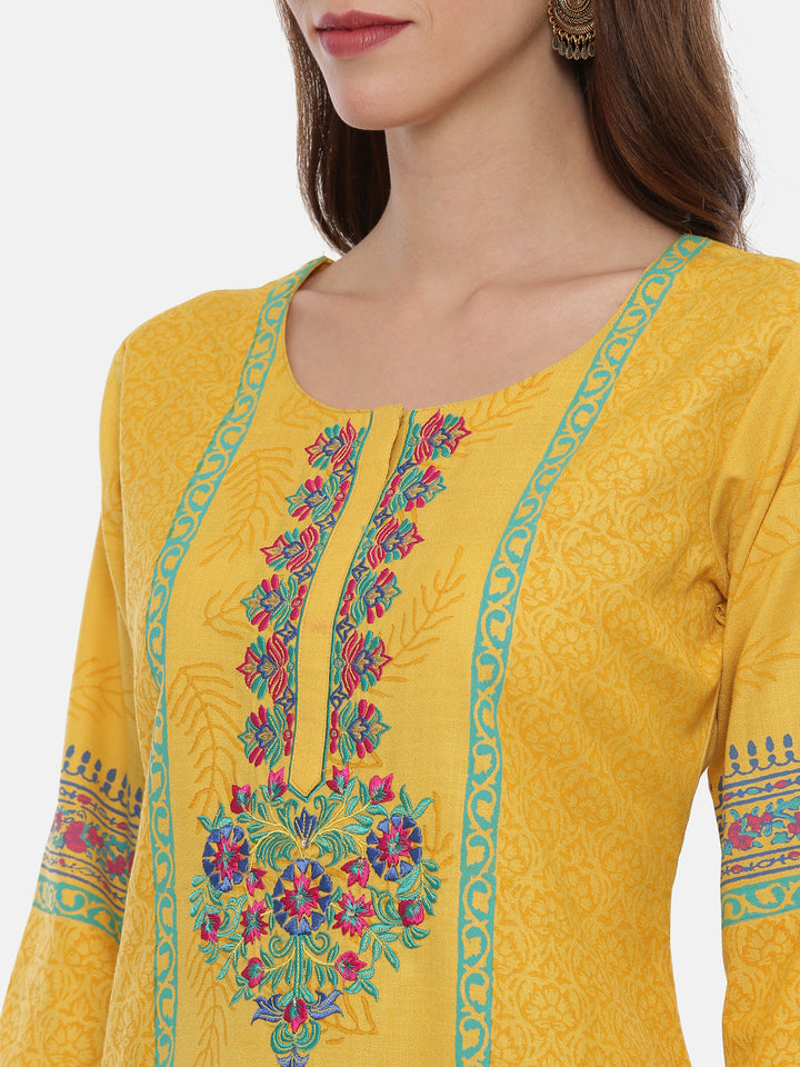 Neerus Yellow embroidered kurta set with churidar and dupatta - back view