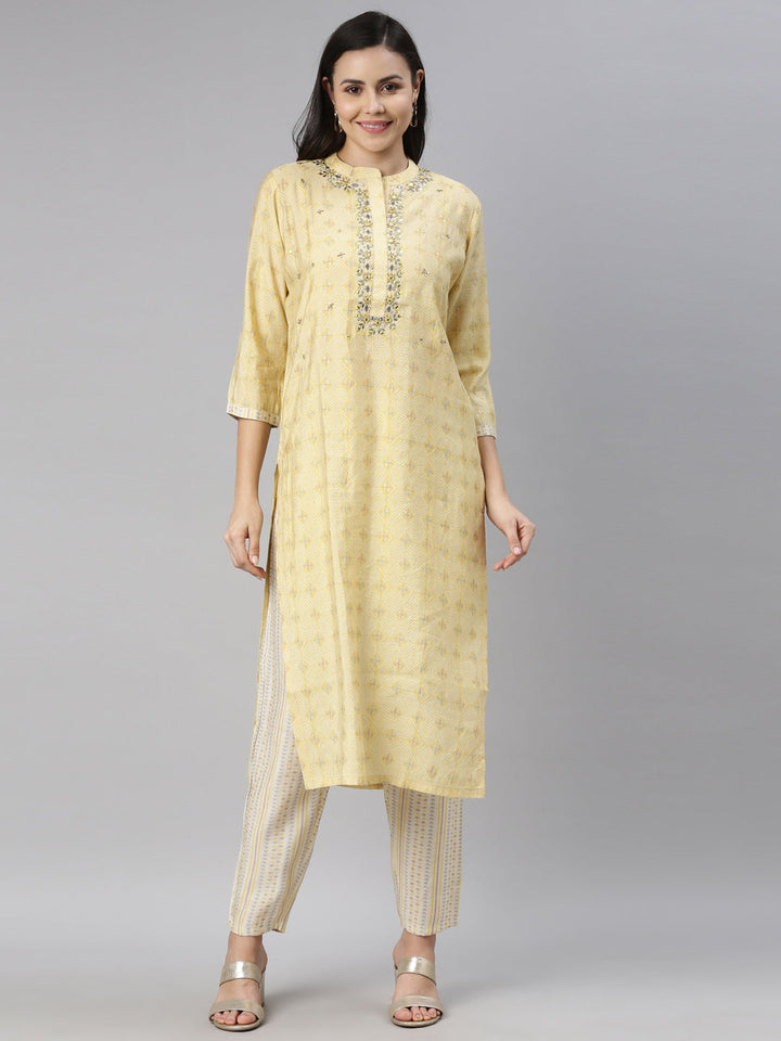 Neerus Yellow mirror work embroidered kurta set - front view