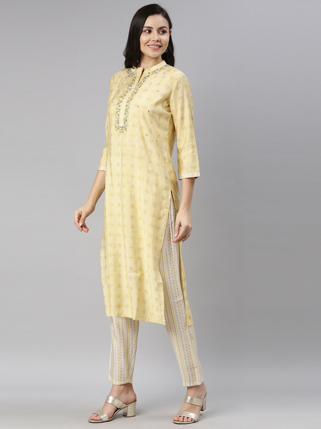 Neerus Yellow mirror work embroidered kurta set - back view