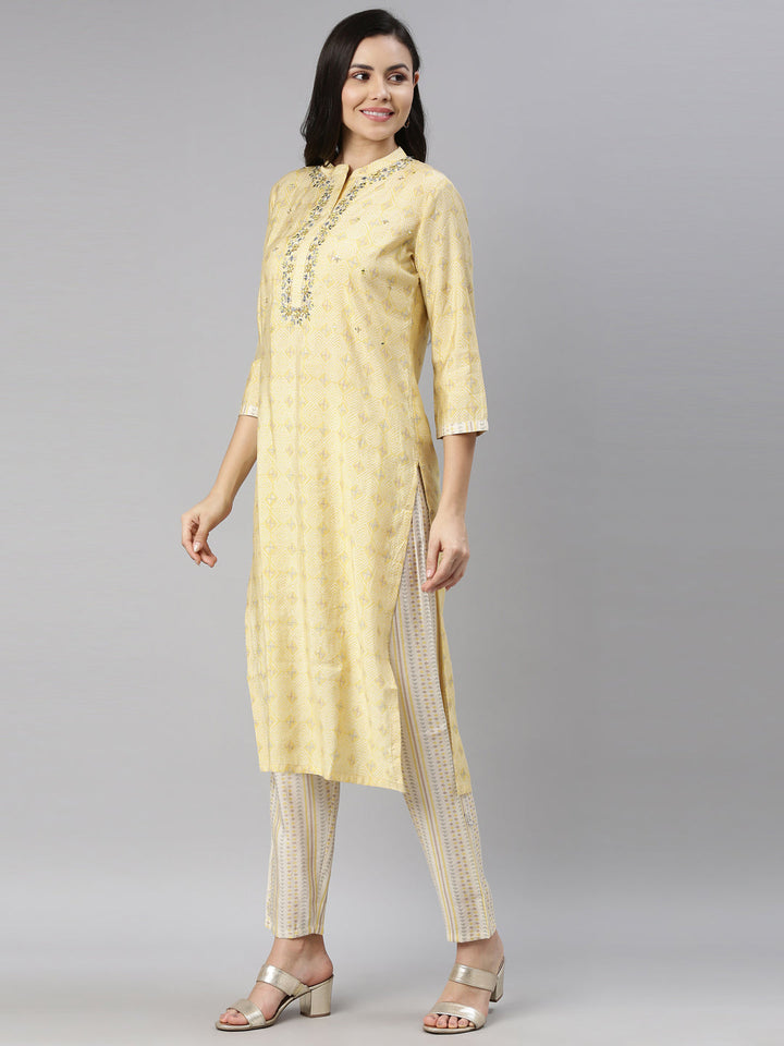 Neerus Yellow mirror work embroidered kurta set - back view