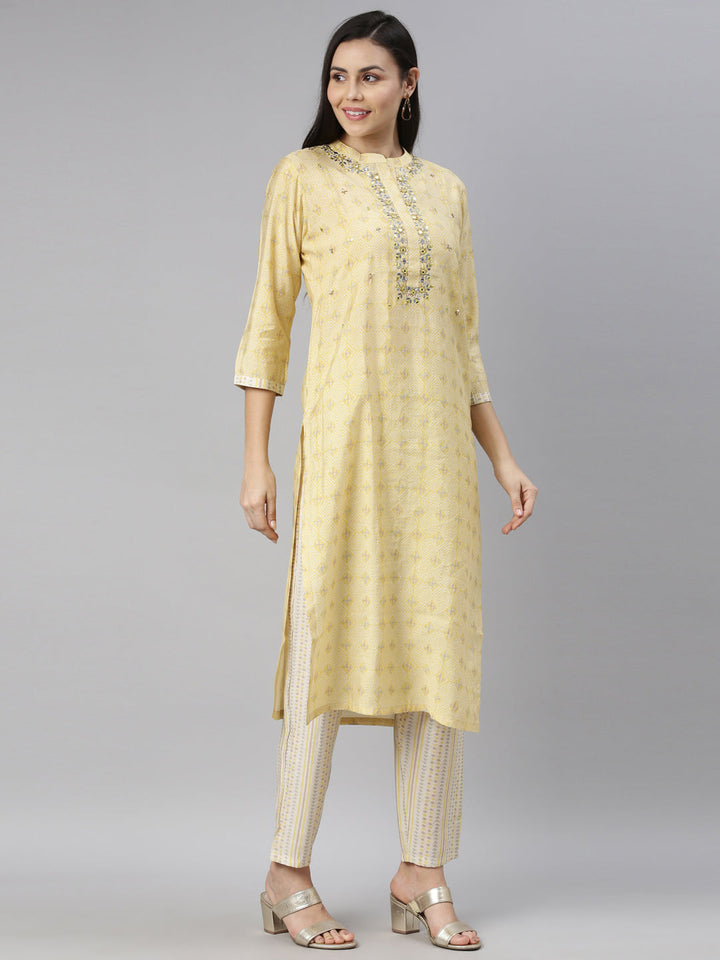 Neerus Yellow mirror work embroidered kurta set - side view
