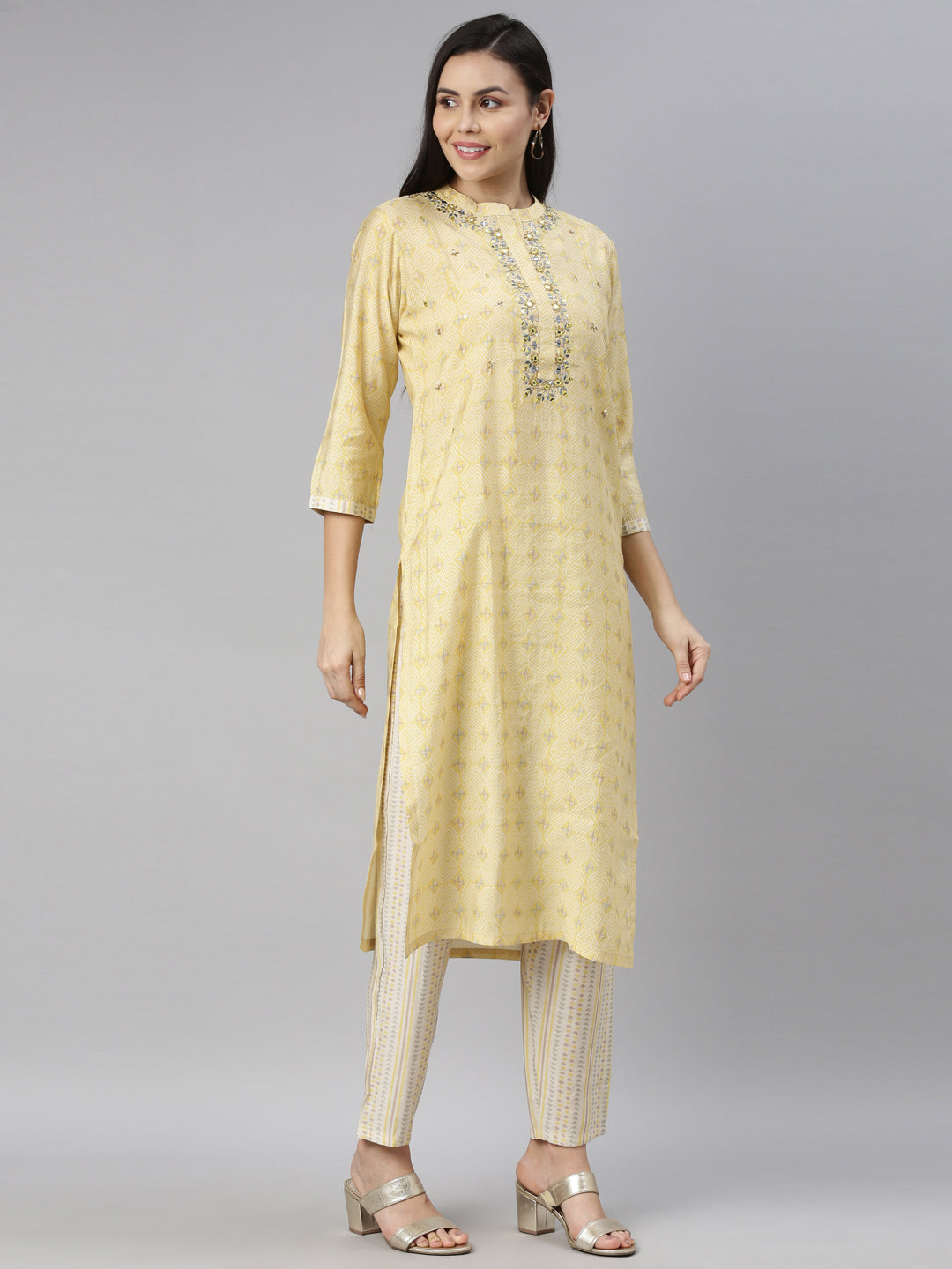 Neerus Yellow mirror work embroidered kurta set - side view