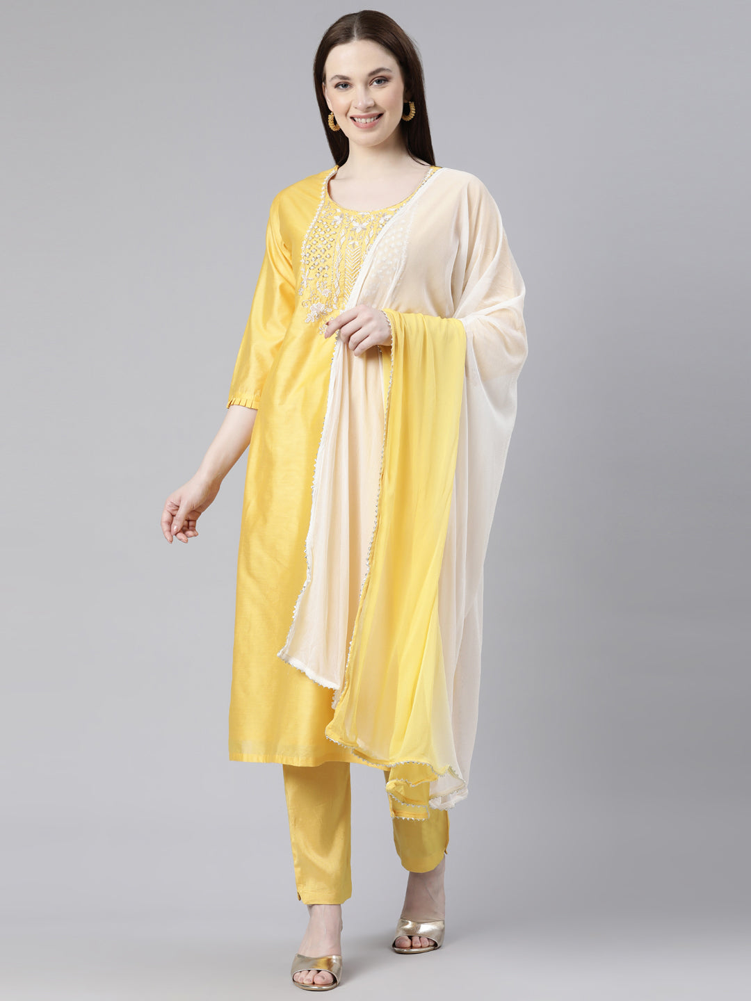 Neerus Yellow cotton solid kurta set with trouser and dupatta - front view