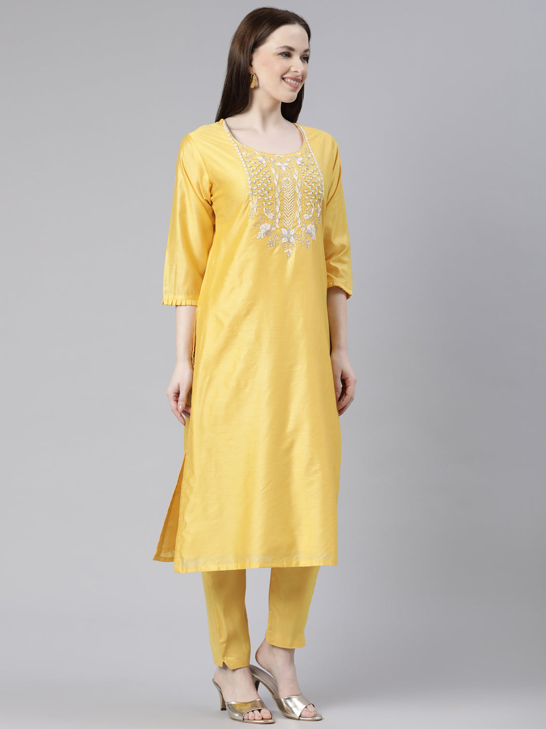 Neerus Yellow cotton solid kurta set with trouser and dupatta - back view