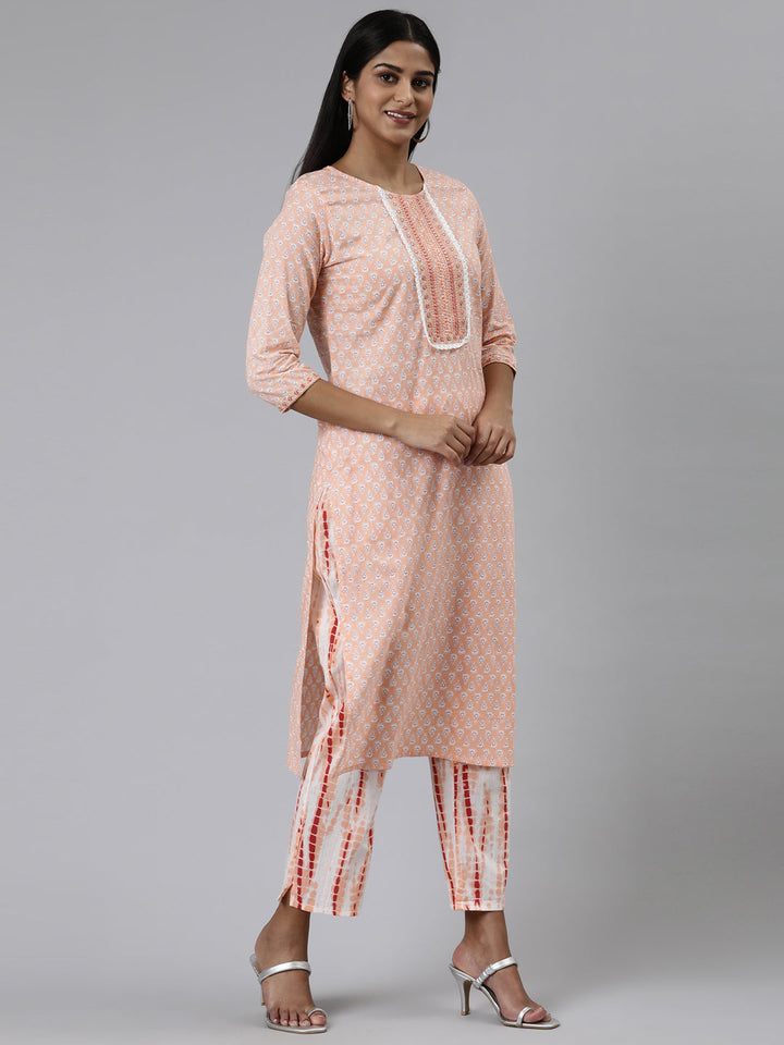 Neerus Orange cotton printed kurta set with trouser and dupatta - back view