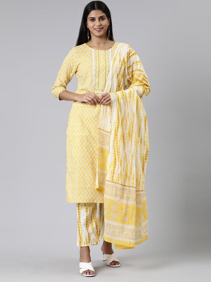 Neerus Yellow cotton printed kurta set with trouser and dupatta - front view