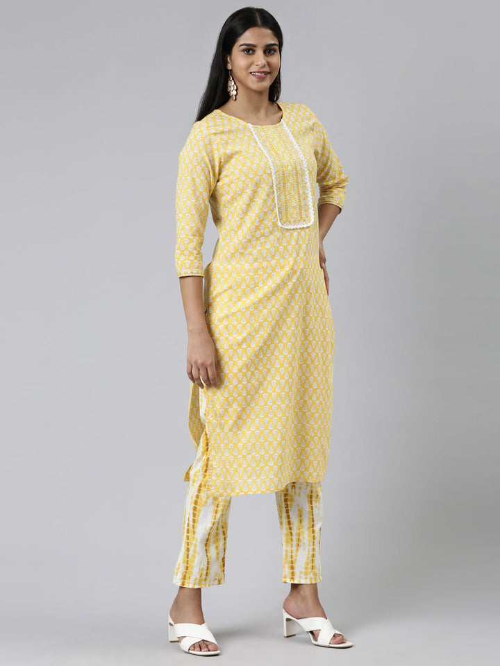 Neerus Yellow cotton printed kurta set with trouser and dupatta - back view