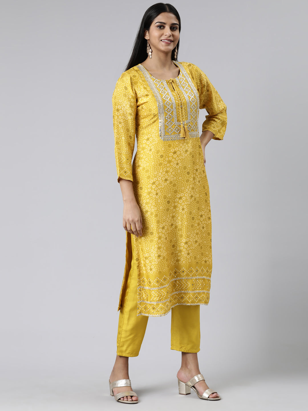 Neerus Yellow cotton printed kurta set with trouser and dupatta - back view