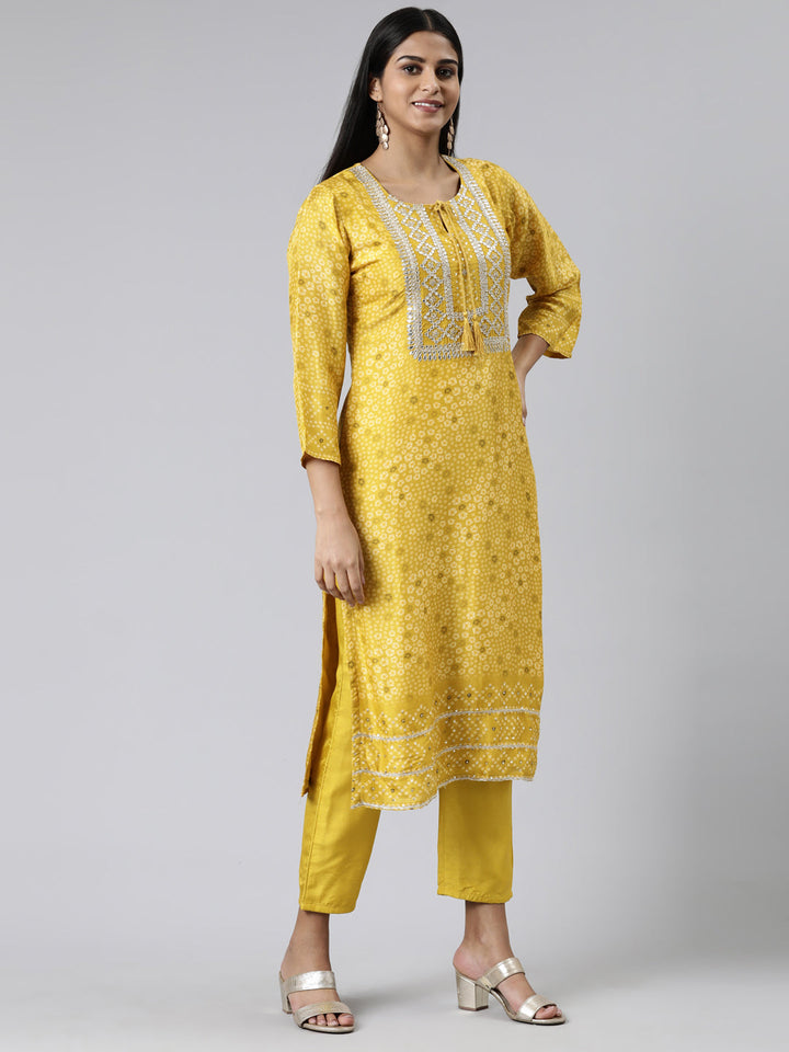Neerus Yellow cotton printed kurta set with trouser and dupatta - back view