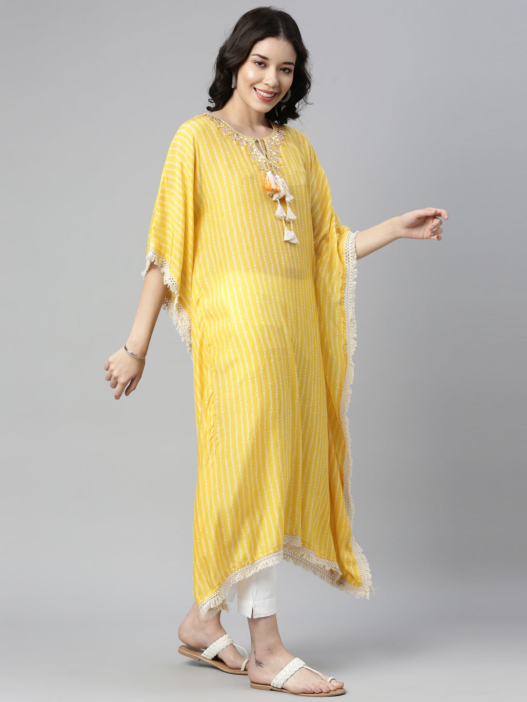 Neerus Yellow muslin mirror work kaftan kurti - front view