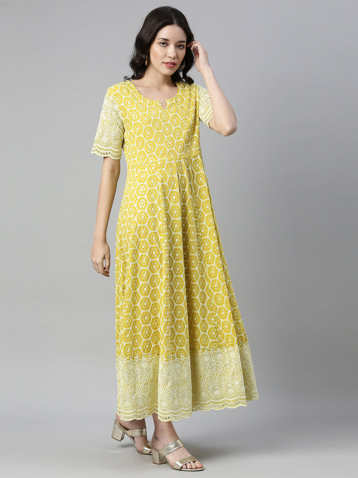 Neerus Yellow cotton chikankari anarkali kurti - front view