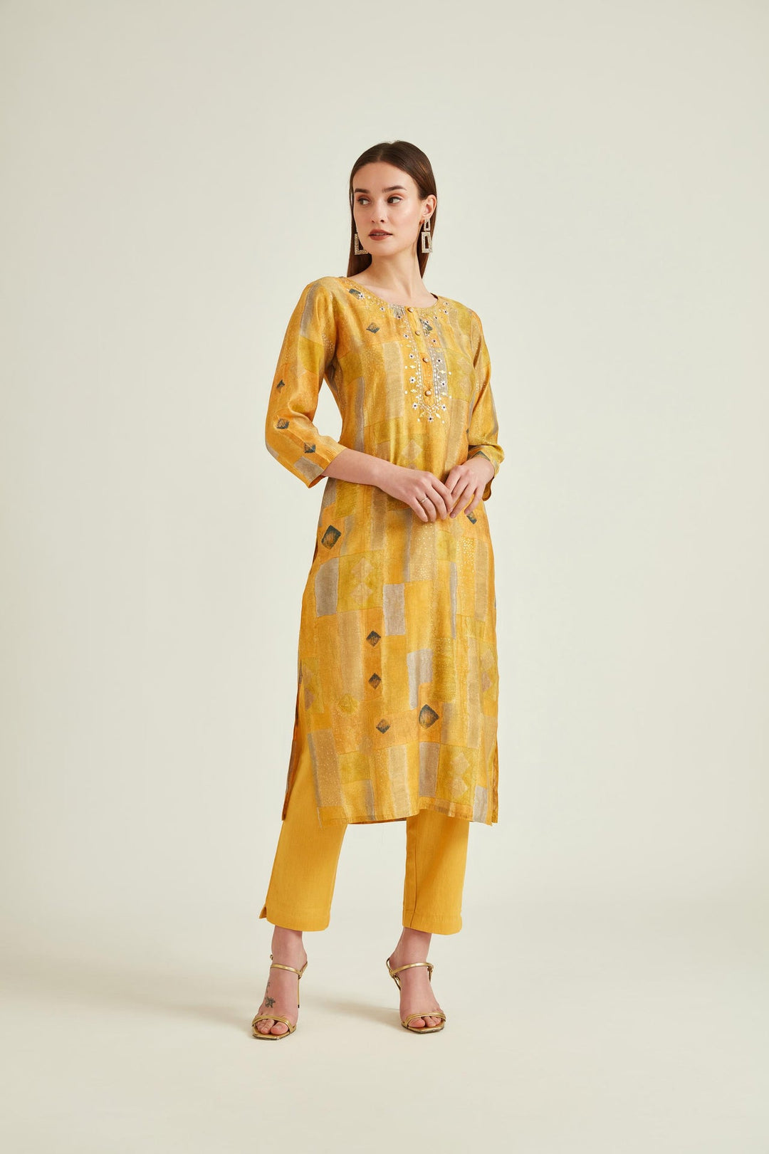 Neerus Yellow muslin mirror work kurta set - front view
