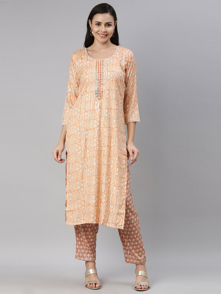 Neerus Orange rayon solid kurti - front view