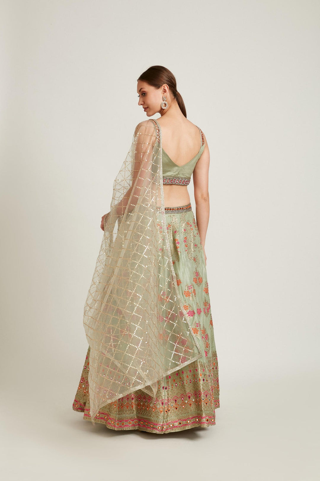 Neerus Green Banarasi woven lehenga choli set - side view