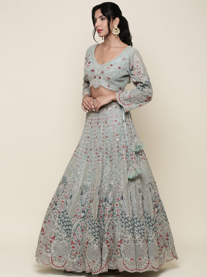 Sea green net heavy embroidered Three piece ghagra set