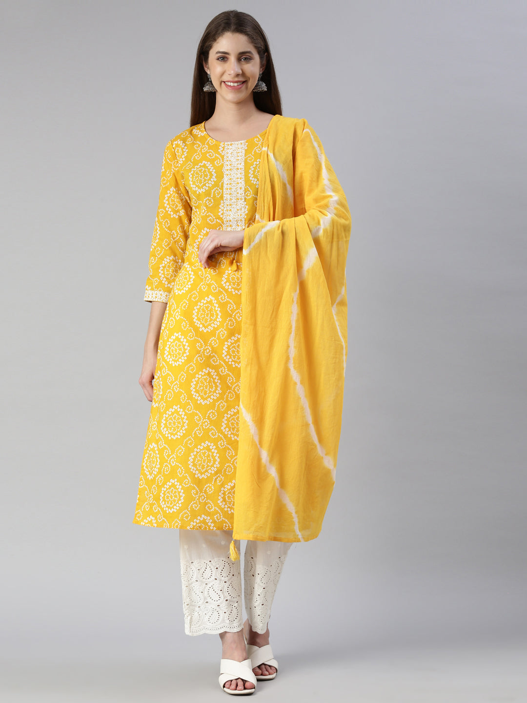 Neerus Yellow printed kurta set with palazzo and dupatta - front view
