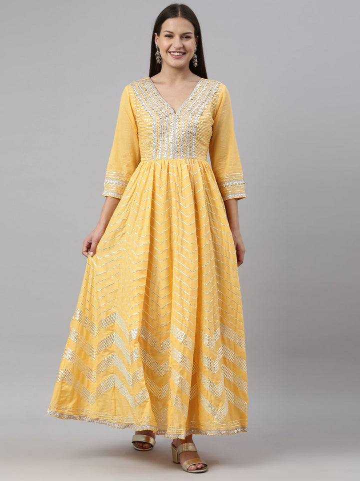 Neerus Yellow cotton embellished anarkali kurti - front view
