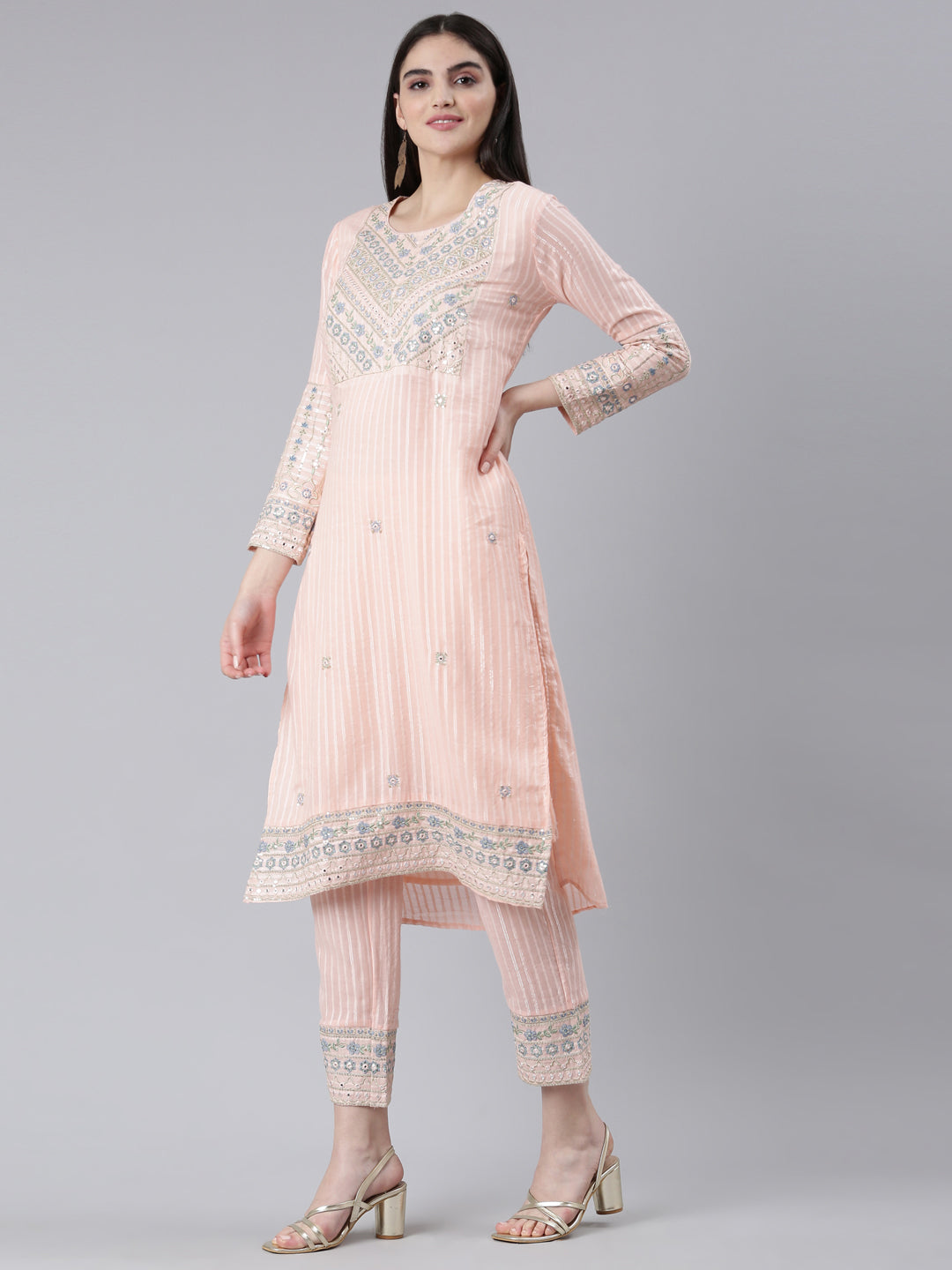 Neerus Orange cotton printed kurta set with trouser and dupatta - back view