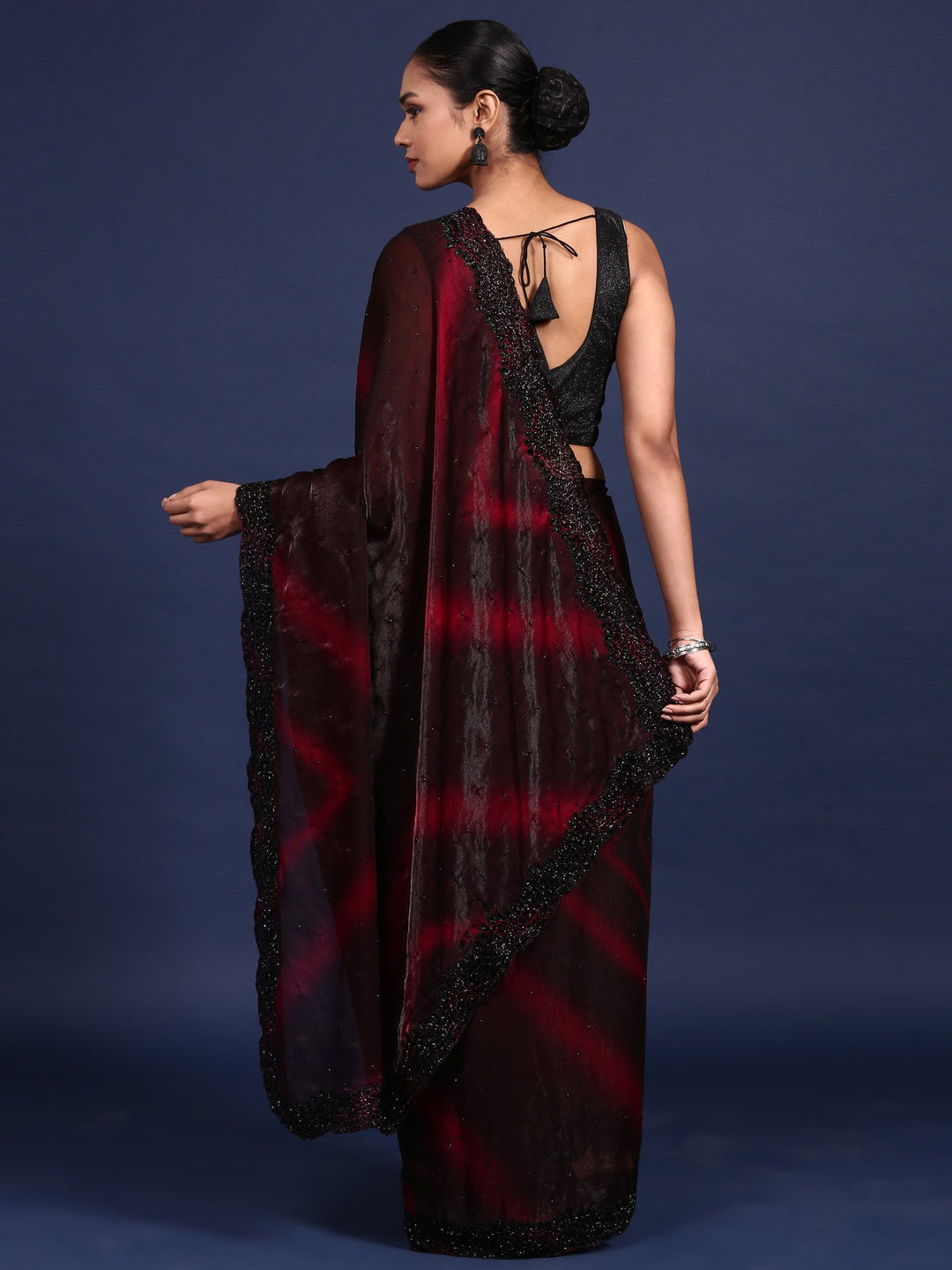 Neerus Maroon embellished shimmer saree - back view