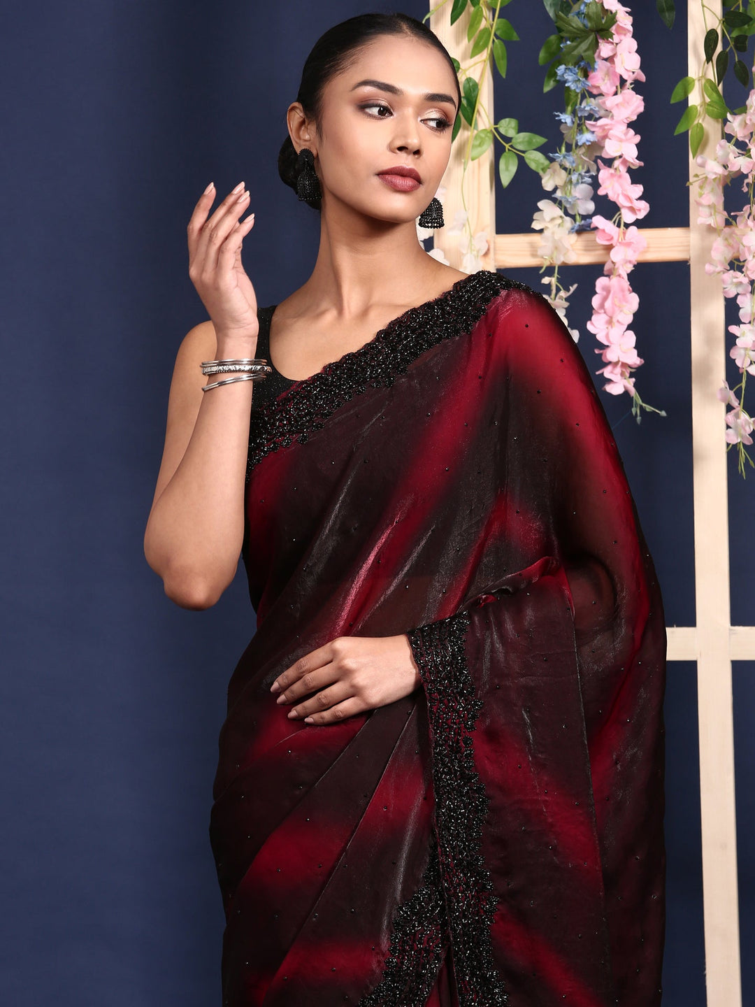 Neerus Maroon embellished shimmer saree - side view