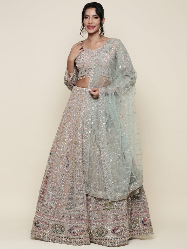 Beige net heavy embroidered three piece ghagra set
