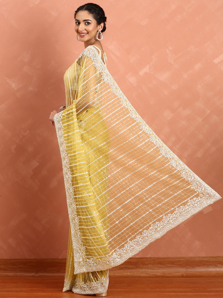 Neerus Yellow net hand embroidered saree - back view