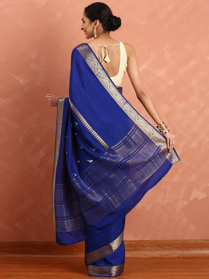 Neerus Blue Silk Woven Saree with Ethnic Pichvai Motifs - side view