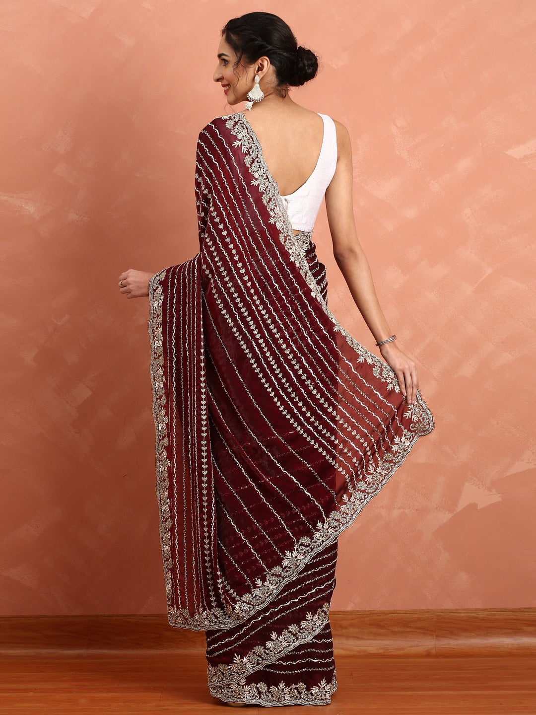 Neerus Maroon hand embroidered saree with Swarovski and cut dana - side view