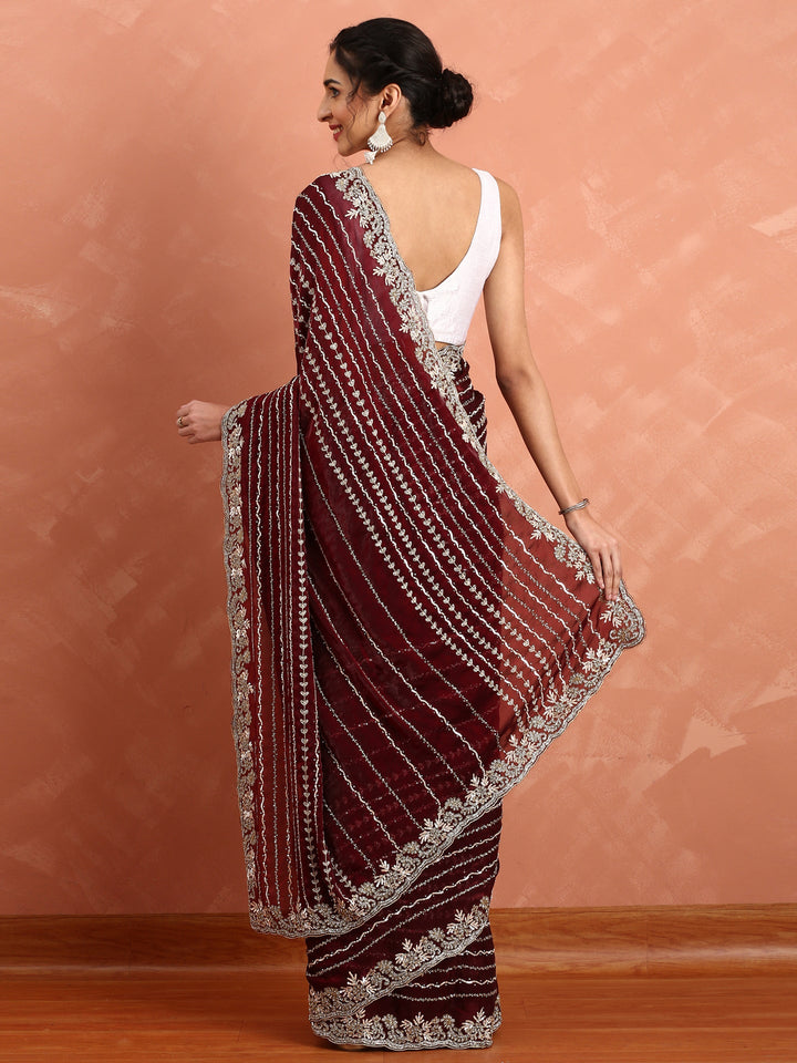 Neerus Maroon hand embroidered saree with Swarovski and cut dana - side view