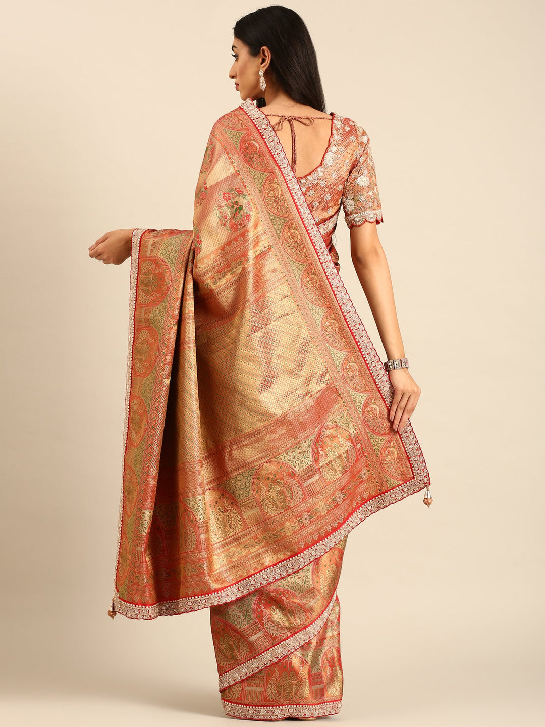 Neerus Red Banarasi hand embroidered saree with gold zardozi work - back view