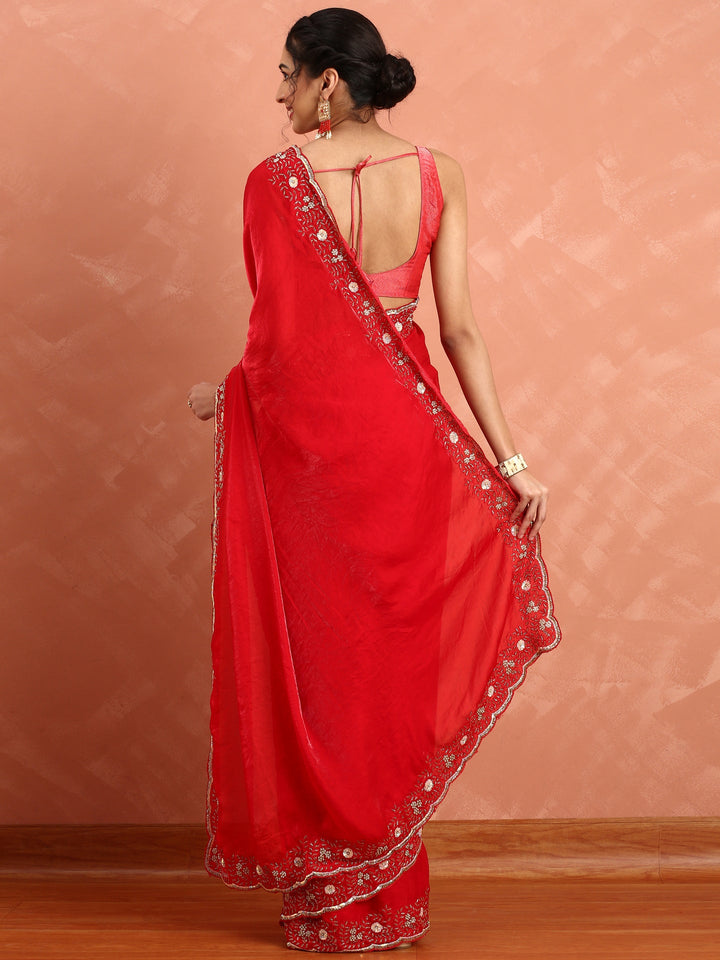 Neerus Red hand embroidered saree with Swarovski stones - back view