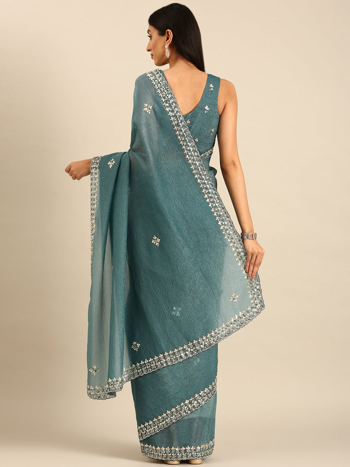 Neerus Green tissue embellished saree with heavy blouse - back view