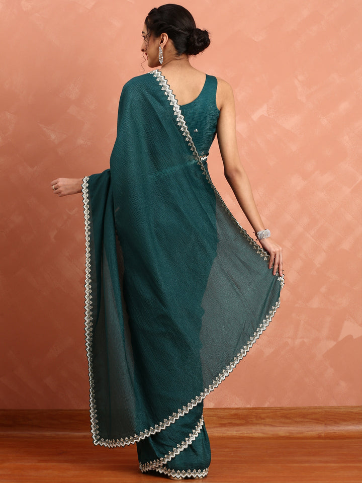 Neerus Green net embellished saree with pearl embroidery - back view