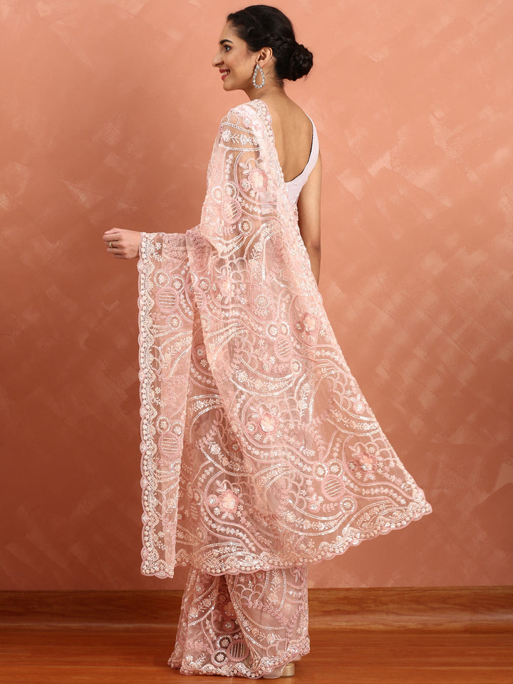 Peach net saree with pearl and sequins hand embroidery with scallop border