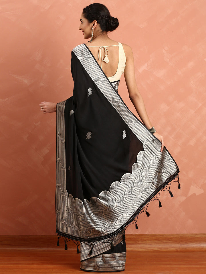 Neerus Black Banarasi woven saree with silver zari motifs - side view