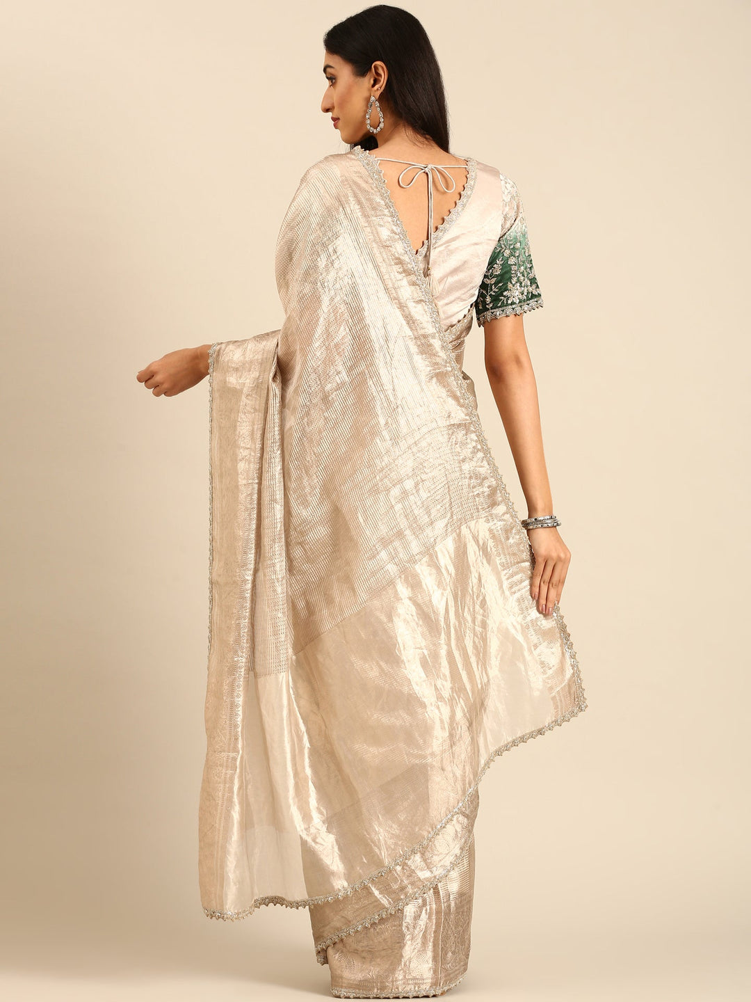 Neerus Grey tissue woven saree with green contrast blouse - back view